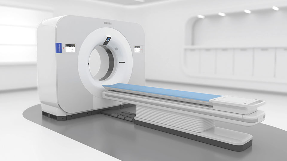 Scanner Philips Spectral CT 7500 avec boutons sur le détecteur spectral, l'anneau, la table d'examen et le panneau de commande du statif