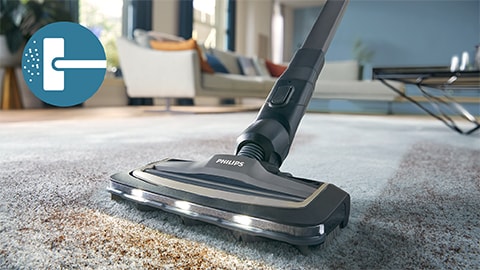 Le Philips AquaTrio sans fil Vacuum & Wash série 9000 nettoie une moquette et un tapis