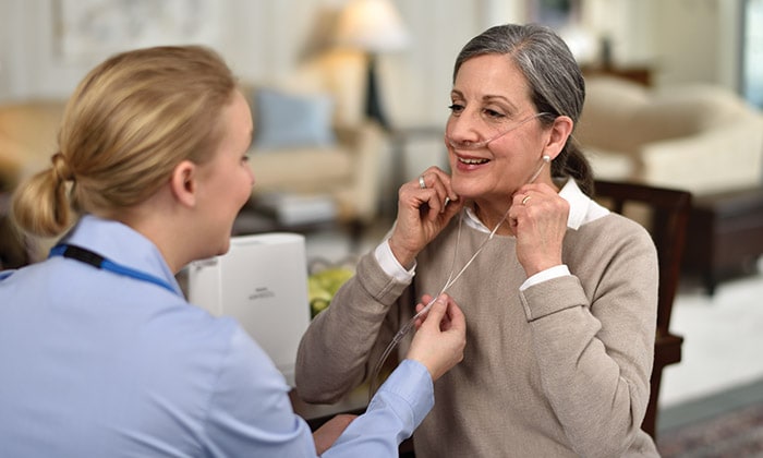 Nurse helping woman