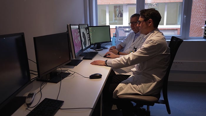 pathologists consult with digipath scanner